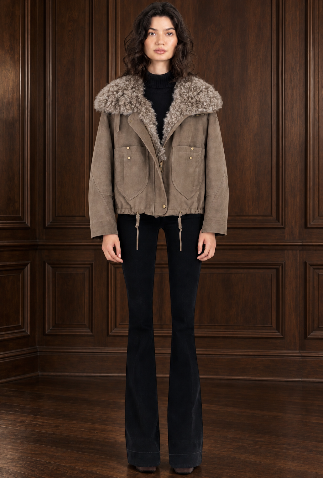 ALVIN VALLEY taupe shearling jacket on model against dark walnut paneling