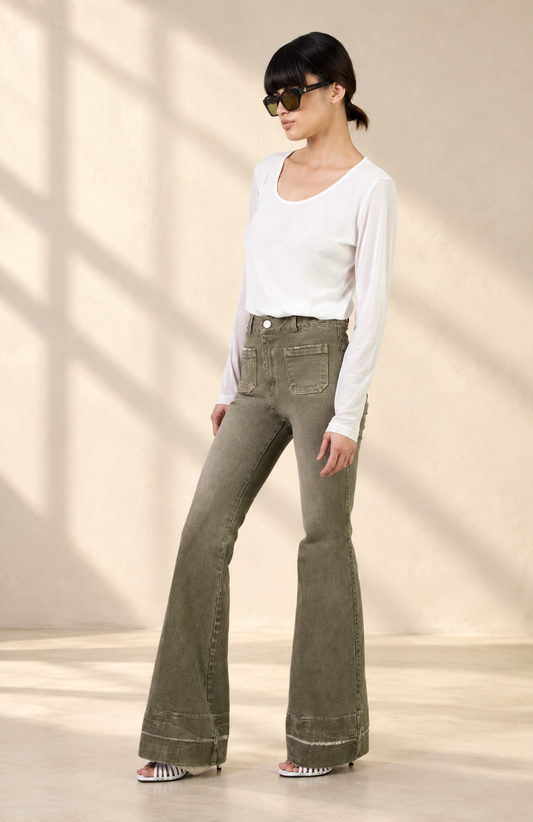Doyenne green jeans in soft window light