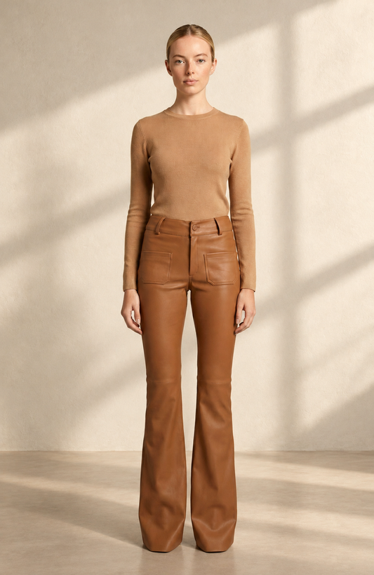 Doyenne leather-camel jeans in soft window light