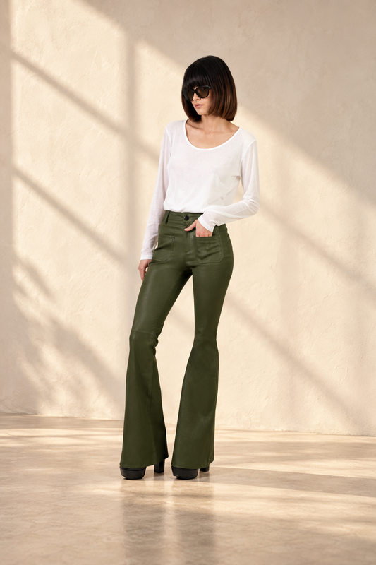 Doyenne olive jeans in soft window light