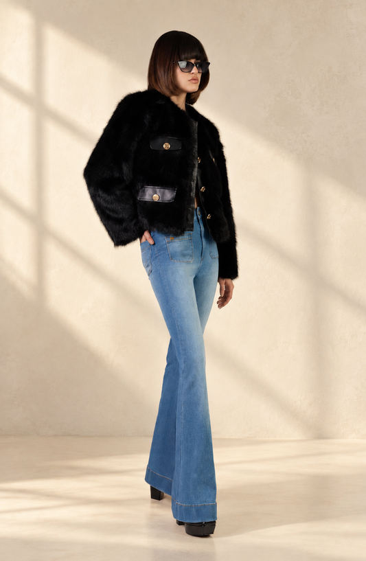 Doyenne straight-indigo jeans in soft window light