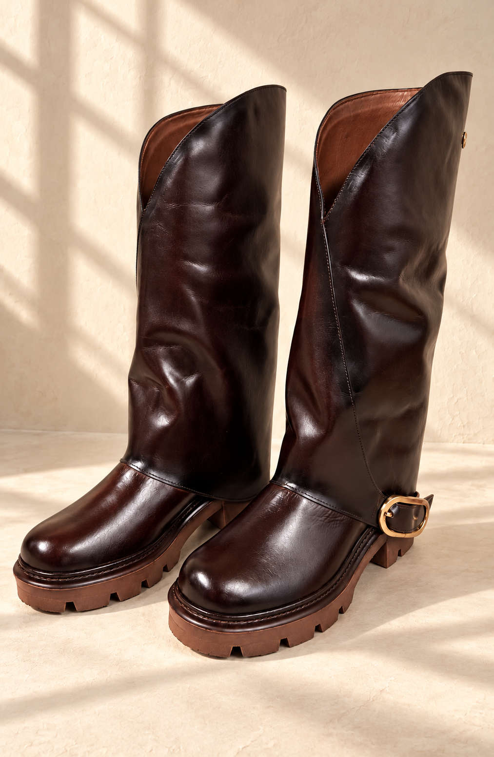 Wellington Boot with Buckle in Oxblood — pair view with window shadows